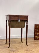 A late Regency mahogany work table, the well figured top opening to a plain interior, above a