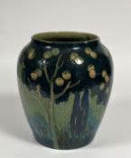 An unusual large Royal Doulton stoneware vase, c. 1920-30, painted with a canopy of fruit trees in
