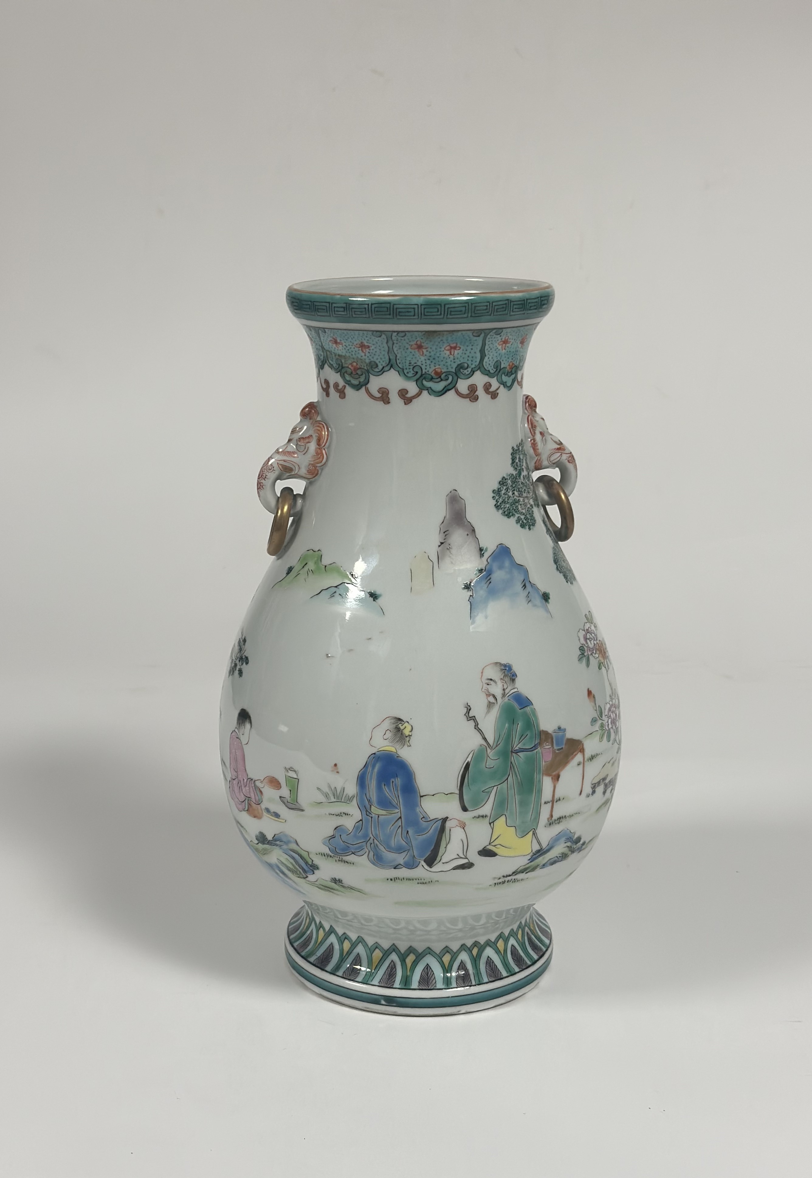 A modern Chinese famille verte style baluster vase decorated with three figures in a garden and