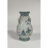 A modern Chinese famille verte style baluster vase decorated with three figures in a garden and