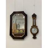 A 1930's oak wall hanging mirror with beeded moulding and bevelled edge (84cm x 54cm) together