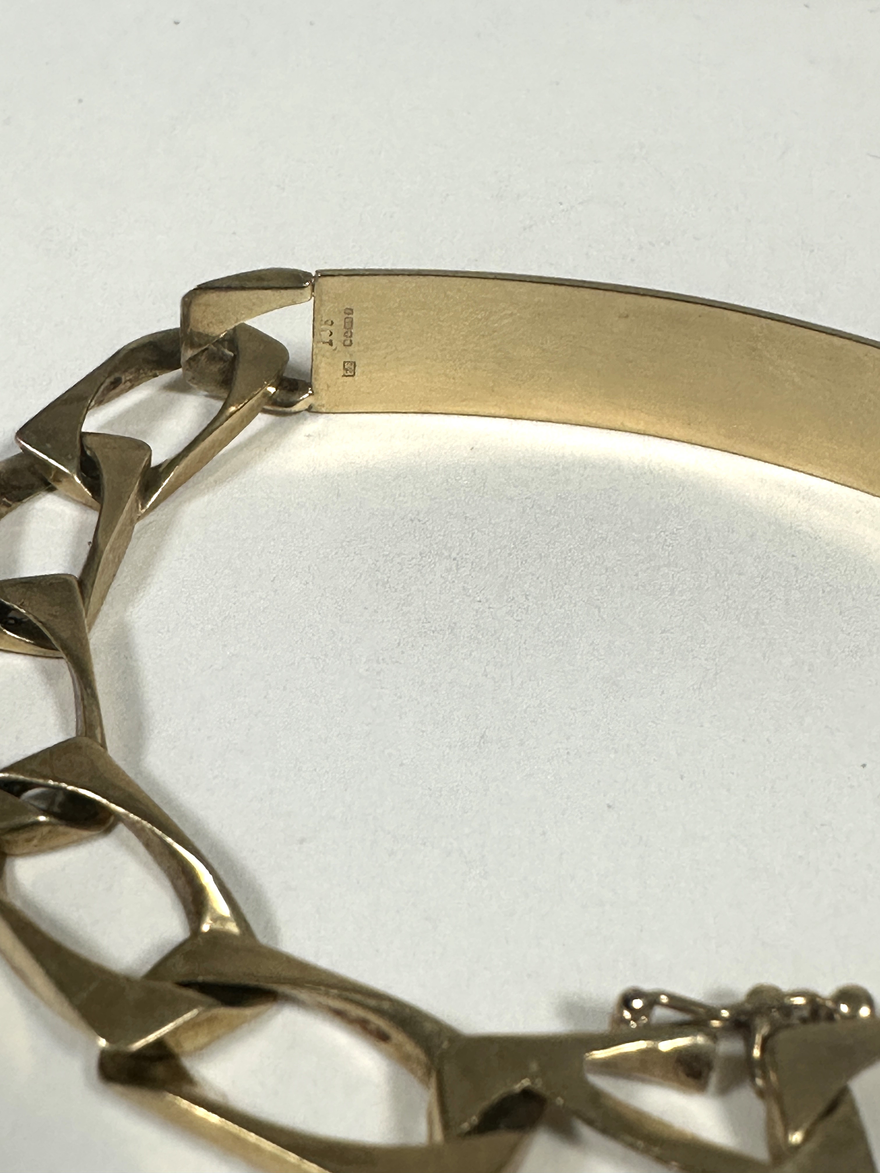 A 9ct gold flat kerb link identity bracelet, uninscribed, (D x 8cm). 17.38g - Image 2 of 2