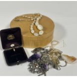 A collection of costume jewellery including two Amethyst rock crystal pendants on chains,