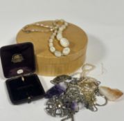 A collection of costume jewellery including two Amethyst rock crystal pendants on chains,