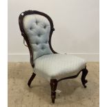 A Victorian carved walnut framed slipper chair with button back upholstery moving on castors H90cm