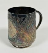 A Victorian London silver tapered chased Christening mug with C scroll handle and engraved with