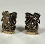 A pair of 9ct gold rectangular Celtic style figure earrings with clip fastenings, (H x 2cm x W x