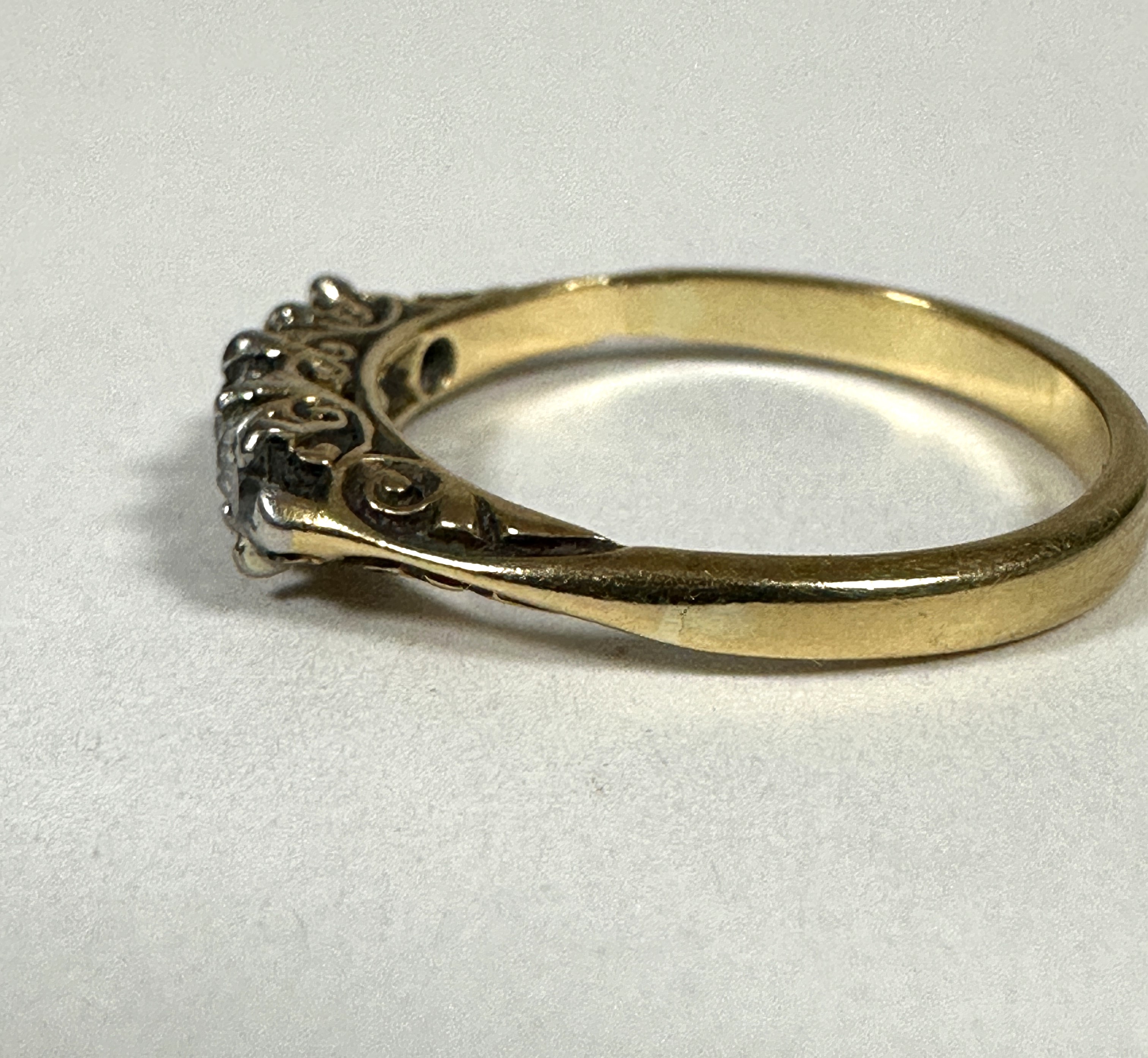 A 18ct gold graduated five stone Diamond ring, the old cut stones mounted in white metal claw - Image 2 of 3