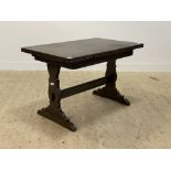 Ercol, a stained elm and beech duo drawer leaf refectory style dinning table, the rectangular top