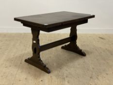 Ercol, a stained elm and beech duo drawer leaf refectory style dinning table, the rectangular top