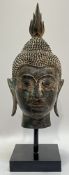An U-Thong style Thai bronze bust of Shakyamuni Budhha mounted on a square base (h- 36cm)