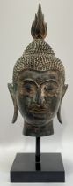 An U-Thong style Thai bronze bust of Shakyamuni Budhha mounted on a square base (h- 36cm)