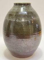 A large studio pottery stoneware vase glazed in red/brown and green, the mouth with nuka/dolomite