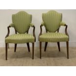 A pair of mahogany framed drawing room chairs in the Georgian style, early 20th century, the