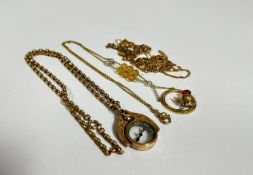 A collection of five gilt metal chains, an Edwardian compass pendant on gilt metal belcher style