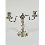 A modern London Silver two branch candelabrum with central baluster knop stem raised on circular