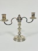 A modern London Silver two branch candelabrum with central baluster knop stem raised on circular