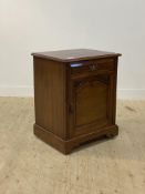 A late Victorian mahogany side cabinet, fitted with a drawer above a panelled cupboard, the