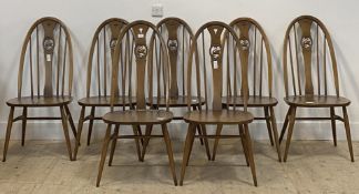 Ercol, a set of seven stained beech and elm hoop and spindle back dining chairs H102cm