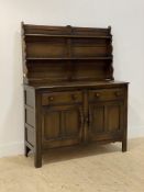 Ercol, a stained oak dresser, with a two height plate rack above base fitted with two drawers and