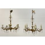 A pair of floral cast gilt brass chandeliers, first half of the 20th century, each with a faceted
