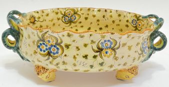 A Cantagalli scalloped-edge Italian majolica planter decorated with floral motifs and serpent