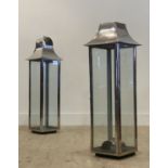 A pair of glazed and chrome plated pagoda form candle holders, (a/f) H87cm