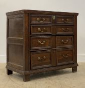 A late 17th century oak chest of drawers, the top with moulded edge above four long graduated and