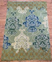 A Kashmiri hand chain stitched wool panel with floral motifs on a green field 175cm x 122cm