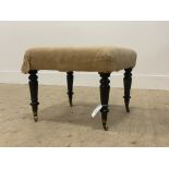 A mid 19th century footstool the upholstered top covered in calico, raised on turned supports with