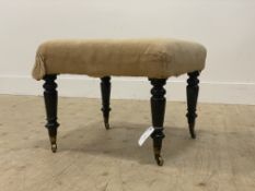 A mid 19th century footstool the upholstered top covered in calico, raised on turned supports with