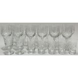 A group of cut-crystal drinking glasses comprising twelve wine glasses (h- 18cm), two smaller