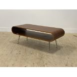 Dwell, a contemporary walnut veneered bentwood coffee table, raised on tapered aluminium supports
