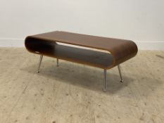 Dwell, a contemporary walnut veneered bentwood coffee table, raised on tapered aluminium supports