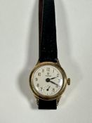 A lady's 9ct gold Tudor manual wind wrist watch, the silvered dial with Roman numerals and seconds