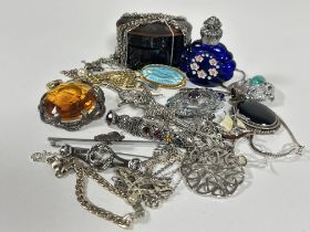 A box containing a collection of white metal and silver jewellery including a pair of paste pearl