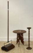 An eastern style carved hardwood occasional table, the circular top with simulated bone inlay raised