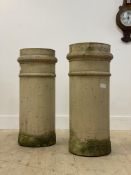 A pair of 19th century terracotta chimney pots of cylindrical outline, H76cm
