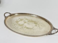 A Epns oval engraved tow handled tea tray, rubbed , ( L x 74cm x W x 45)