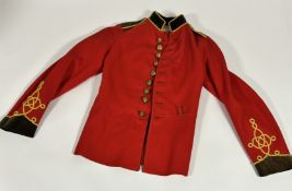 A World War I period 5th Dragoon Guards scarlet wool tunic with brass buttons, velvet collar, cuffs,