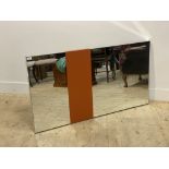 A contemporary sectional wall hanging mirror 130cm x 71cm