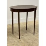 An Edwardian mahogany occasional table, the oval top raised on square tapered supports H70cm, W73cm,