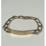 A 9ct gold flat kerb link identity bracelet, uninscribed, (D x 8cm). 17.38g