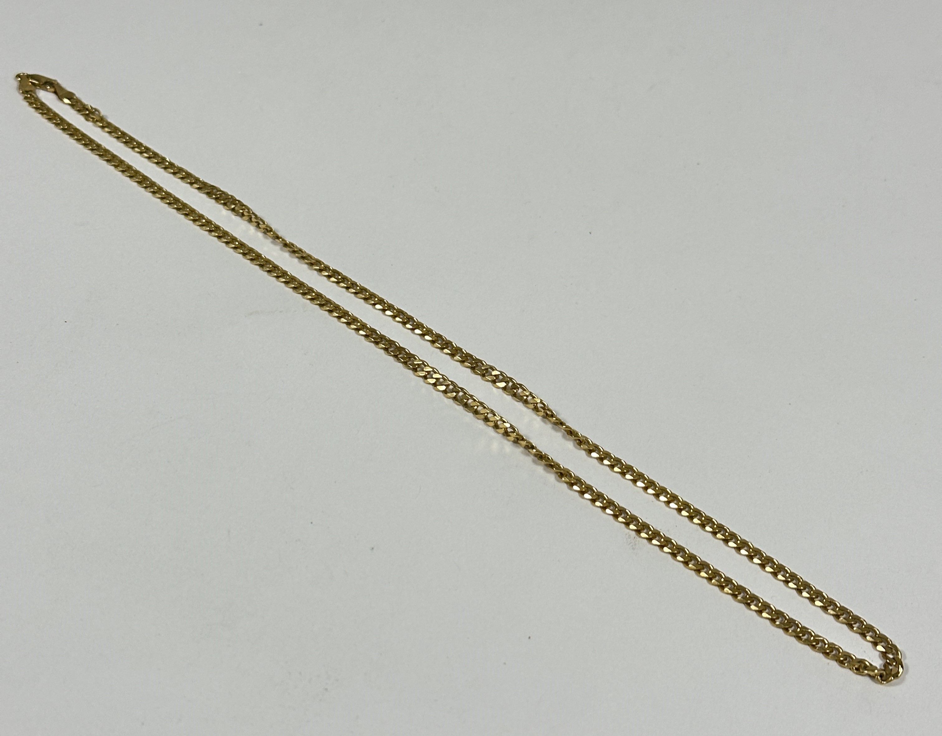 A 9ct gold kerb link necklace with lobster claw clasp fastening, no signs of damage, hard solder