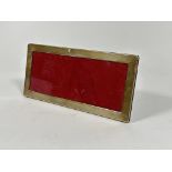 A modern London silver rectangular mounted photograph frame with red velvet back and easel stand, (H