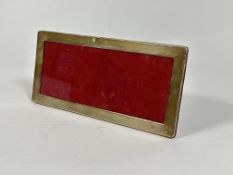 A modern London silver rectangular mounted photograph frame with red velvet back and easel stand, (H