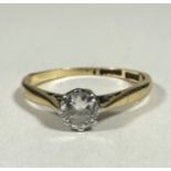 A 18ct gold and platinum solitaire Diamond round brilliant ring set in claw mount, approximately 0.