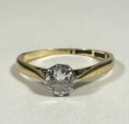 A 18ct gold and platinum solitaire Diamond round brilliant ring set in claw mount, approximately 0.