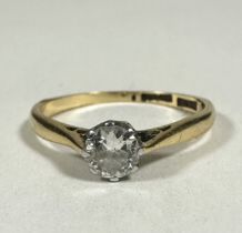 A 18ct gold and platinum solitaire Diamond round brilliant ring set in claw mount, approximately 0.