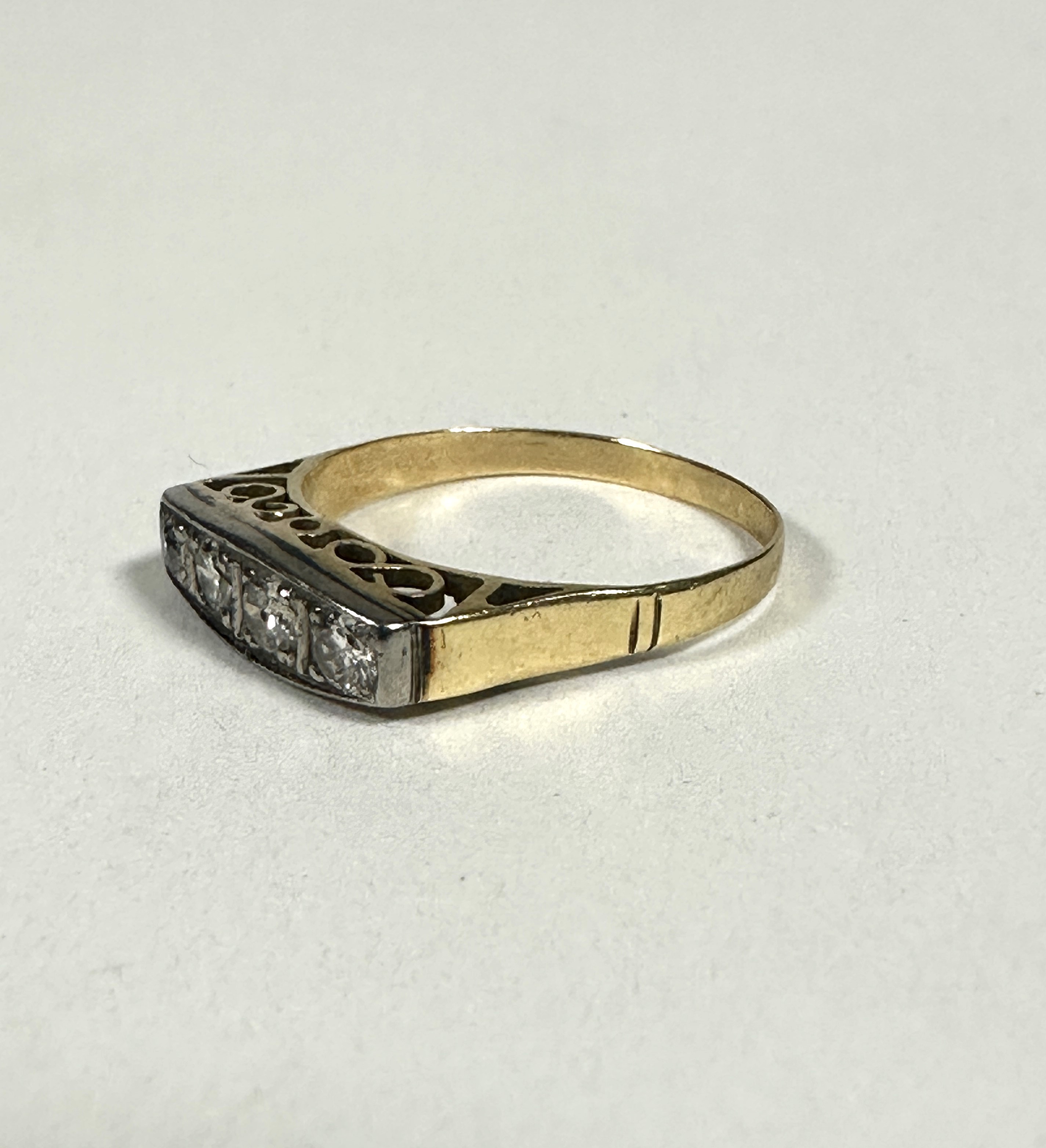 An Edwardian yellow and white metal ring set four graduated old cut Diamonds in millegrain - Image 2 of 3